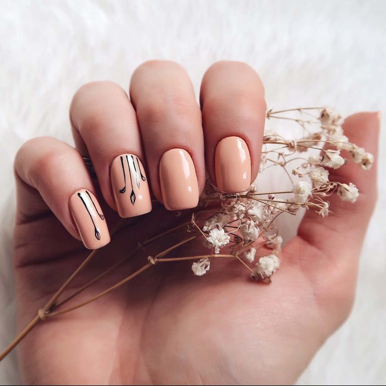 lovely nude nails holding flower